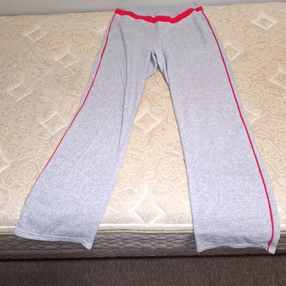 A pair of bcg size ladies small lounge pants. Grey with pink accents.